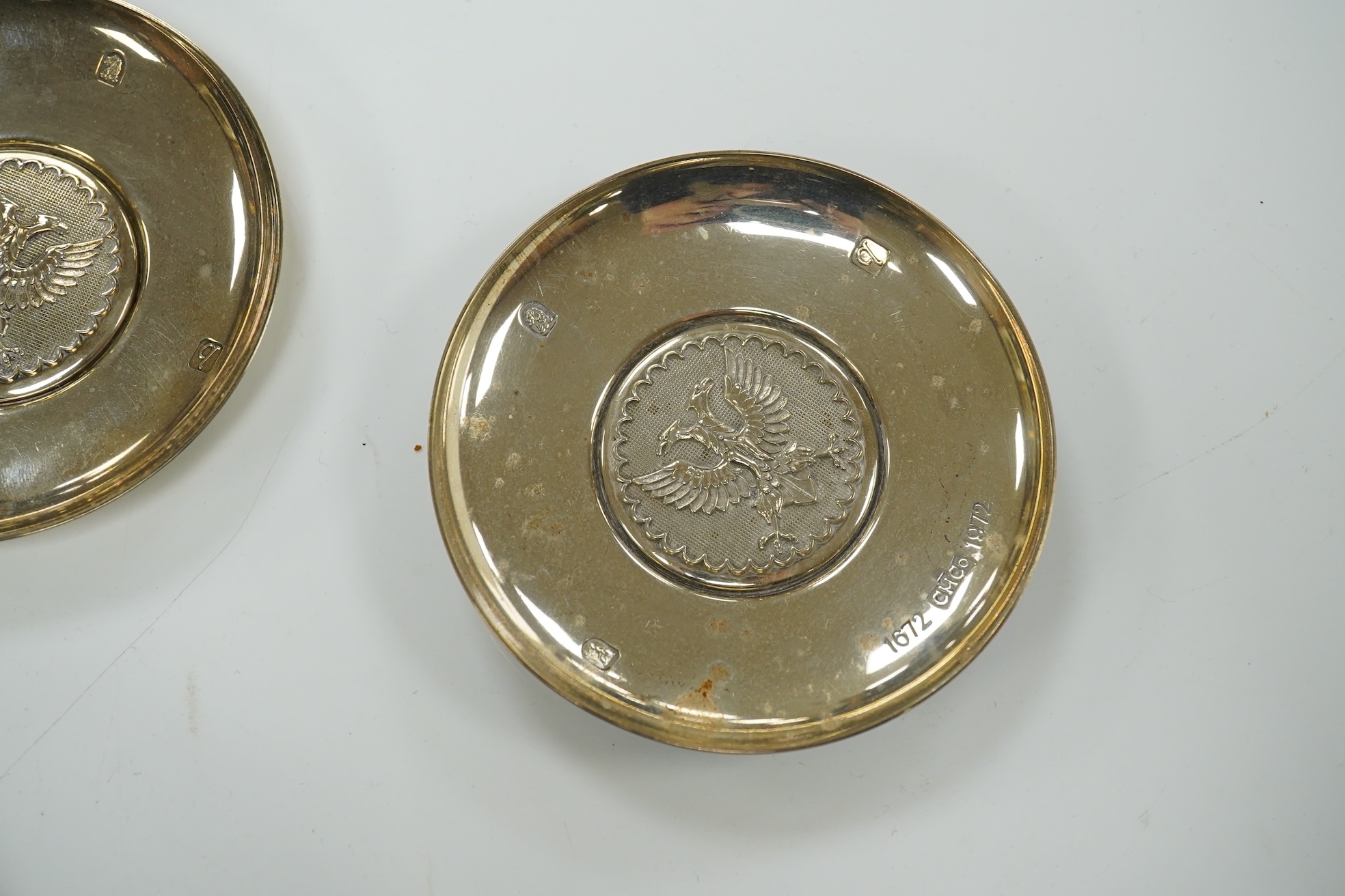 A pair of 1970's Brittania standard silver Prussian eagle inset commemorative trinket dishes, 96mm and an earlier pair of fluted pedestal bonbon dishes. Condition - fair